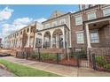 Beautiful home exterior with a covered porch, brick accents, and manicured lawn at 4308 Southside Dr, Acworth, GA 30101