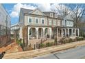 A lovely street view featuring multiple townhomes with inviting front porches and manicured lawns at 4308 Southside Dr, Acworth, GA 30101