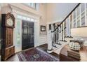 Elegant foyer with staircase, complemented by hardwood floors and classic decorative elements at 4742 Balmoral Ne Way, Marietta, GA 30068