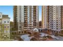 Exterior of a high-rise condominium complex featuring multiple balconies and manicured grounds at 799 Hammond Dr # 219, Atlanta, GA 30328