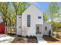 Contemporary two-story home featuring modern windows and a well-maintained front yard at 145 Cedarwood Ln, Roswell, GA 30075