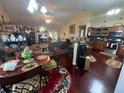 Open-concept kitchen with stainless steel appliances and adjacent living area at 25 Horseshoe Ct, Covington, GA 30014