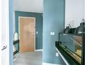 Modern condo entryway with stylish decor, featuring a sleek console table, updated light fixtures, and neutral paint at 361 17Th St # 2122, Atlanta, GA 30363