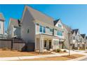 Inviting two-story home with a two-car garage and a well-maintained lawn, showcasing a comfortable Gathering residence at 906 Bingham St, Woodstock, GA 30188