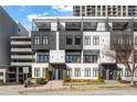 Striking townhome featuring multi-story balconies, sleek black and white design, and convenient parking at 223 16Th Nw St # 2, Atlanta, GA 30363