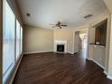 Comfortable living room with fireplace and hardwood floors, filled with natural light at 2643 Winslow Ridge Dr, Buford, GA 30519