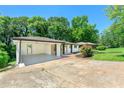 Attractive single-story home showcasing a carport and verdant lawn, creating a welcoming exterior aesthetic at 2682 Miriam Ln, Decatur, GA 30032