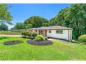 Well-maintained lawn with decorative landscaping and shrubs around the perimeter of the house at 2682 Miriam Ln, Decatur, GA 30032