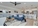 Open-concept living space featuring a modern kitchen, living room, and stylish decor at 4541 Moray Dr, Mableton, GA 30126