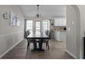 Elegant dining room with wood floors, large windows, and stylish decor at 70 Nw Willow Bend Dr, Cartersville, GA 30121