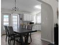 Spacious dining area with a large table, pendant lighting, and access to the kitchen at 70 Nw Willow Bend Dr, Cartersville, GA 30121