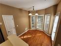 Bright breakfast nook area with hardwood floors and lots of natural light at 959 Gettysburg Way, Locust Grove, GA 30248