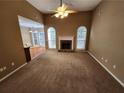 Spacious living room featuring a cozy fireplace and an abundance of natural light at 959 Gettysburg Way, Locust Grove, GA 30248
