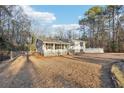 Spacious home exterior with fenced yard and tree line at 2248 Bethel Rd, Conyers, GA 30012