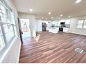 Open-concept living room with new flooring and natural light, perfect for entertaining and relaxation at 2182 Rosewood Rd, Decatur, GA 30032