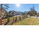 Beautiful white brick home featuring a long, curved driveway at 10745 Shallowford Rd, Roswell, GA 30075