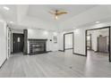Spacious living room featuring wood-look floors and a stylish, updated fireplace with black accents at 1310 Dillon Rd, Austell, GA 30168