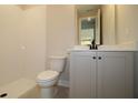 Well-lit bathroom with a walk-in shower, modern vanity, and neutral color scheme at 206 Wild Ginger Bend, Woodstock, GA 30188