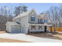 Well-manicured home with a spacious driveway leading to a two-car garage at 2723 Byess Ct, Marietta, GA 30064