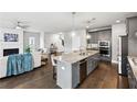 Spacious kitchen with a large island, stainless steel appliances, and an open view to the living room at 3139 Stonegate Sw Dr, Atlanta, GA 30331