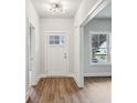 Inviting entryway with wood floors, white trim, and a stylish front door with sidelights at 3158 Stonegate Sw Dr, Atlanta, GA 30331