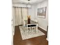 Charming dining area with a wood table, chairs, and stylish decor on hardwood floors at 3571 Parc Sw Cir, Atlanta, GA 30311