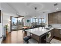 Modern kitchen with island, hardwood floors, and city views at 270 17Th Nw St # 2601, Atlanta, GA 30363