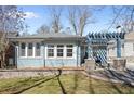 Attractive blue brick house featuring multi-paned windows and a pergola-covered front porch at 28 Peachtree Hills Ne Ave, Atlanta, GA 30305