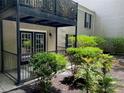 Private patio area with a view of the landscaped garden and brick facade at 3527 Essex Ave # 74, Atlanta, GA 30339