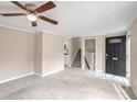 Inviting living room with neutral walls, carpet floors, and staircase entrance to the upper level at 3265 Newcastle Way, Snellville, GA 30039