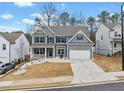 Charming two-story home with blue shutters and a well-manicured front yard at 614 Edgemore Rd, Canton, GA 30114