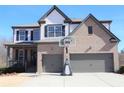 Charming two-story home featuring a two-car garage, basketball hoop, and well-maintained front yard at 5315 Austrian Pine Ct, Cumming, GA 30040