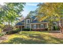 Beautiful two-story home with brick and siding exterior and manicured lawn at 4711 Oakleigh Manor Dr, Powder Springs, GA 30127