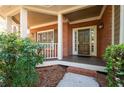 Inviting front porch with brick facade and decorative columns at 4711 Oakleigh Manor Dr, Powder Springs, GA 30127