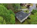 Aerial shot of house showing the roof and the surrounding greenery and other houses nearby at 5730 Paces Pl, Suwanee, GA 30024