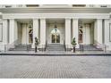 Grand entrance featuring white columns, manicured topiaries, and steps leading to the door at 195 14Th Ne St # Ts8, Atlanta, GA 30309