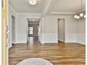 Bright and airy living room with hardwood floors and elegant white trim at 135 Eastmark Way, Fayetteville, GA 30214