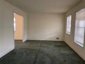 Spacious living room with neutral walls and natural light from two windows at 70 Rockmart Nw Dr, Atlanta, GA 30314