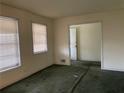 Living room featuring neutral walls and two windows letting in natural light at 70 Rockmart Nw Dr, Atlanta, GA 30314