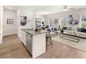 Open-concept living area features modern kitchen, dining space, and stylish living room at 1330 Magnolia Bend Way # 306, Jonesboro, GA 30238