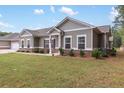 Lovely single-story home with a well-kept lawn, showcasing a welcoming facade and attached garage at 3903 Shelleydale Dr, Powder Springs, GA 30127