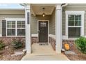 Welcoming front entrance featuring craftsman details, a charming porch, and well-maintained landscaping at 3903 Shelleydale Dr, Powder Springs, GA 30127