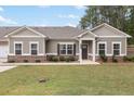 Inviting home exterior with manicured lawn, brick accents, and craftsman-style details for curb appeal at 3903 Shelleydale Dr, Powder Springs, GA 30127
