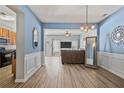 Open-concept dining area showcasing hardwood style floors and lots of natural light at 1832 Willow Branch Nw Ln # H, Kennesaw, GA 30152