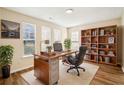 This home office is complete with custom bookshelves, large windows, and a comfortable desk at 4593 Parkway Cir, Atlanta, GA 30349