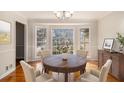 Elegant dining room featuring a large bay window, wood floors, and traditional finishes at 2984 Superior Dr, Dacula, GA 30019
