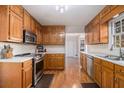 Traditional kitchen with stainless steel appliances, wood cabinets and bright countertops at 2984 Superior Dr, Dacula, GA 30019