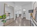 Bright entryway featuring hardwood floors and a large mirror accent at 2850 Stonehall Se Ct, Smyrna, GA 30080