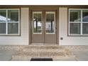 Elegant front door with transom windows and brick steps at 2625 Draw Dr, Marietta, GA 30066