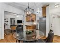 Eat-in kitchen/dining area with hardwood floors, pendant lighting, and stainless steel appliances at 1111 Briarcliff Ne Pl # 2, Atlanta, GA 30306